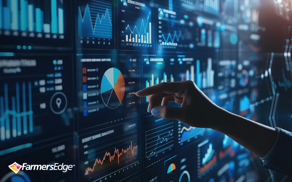 Woman's hand reaching out to a big dashboard showing various data